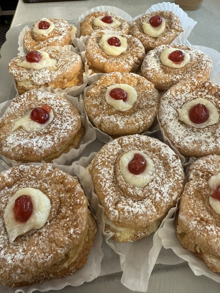 Italian cream puffs with custard and cherry
